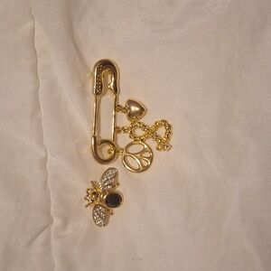 Two piece pin set. Gold tone. Heavy.